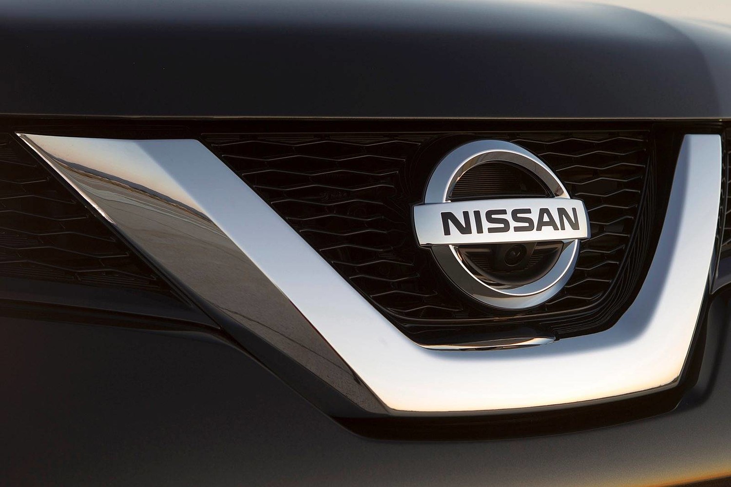 Nissan Rogue SL 4dr SUV Front Badge (2014 model year shown)