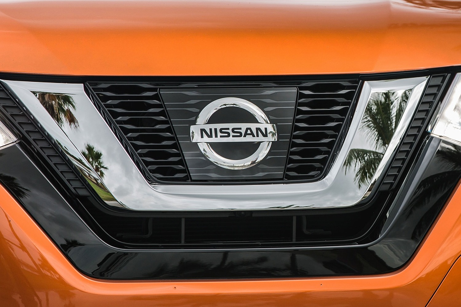 Nissan Rogue SL 4dr SUV Front Badge (2017 model year shown)